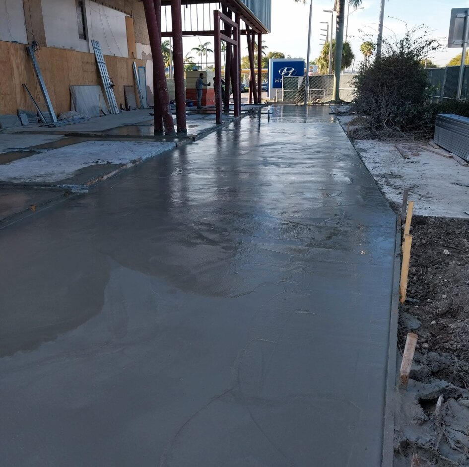 Freshly placed slab-on-grade concrete for a building addition