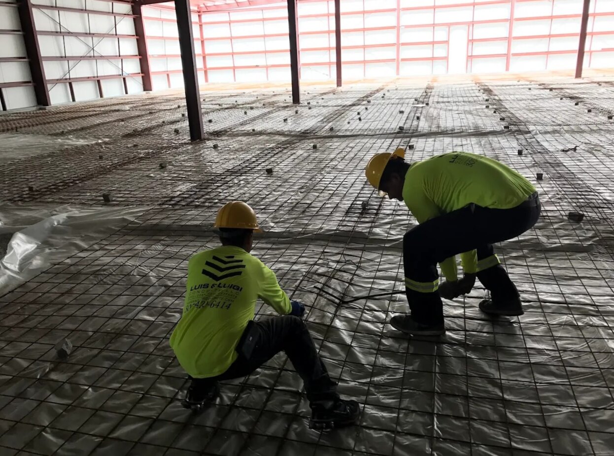 Luis and Luigi crew installing welded wire mesh reinforcement